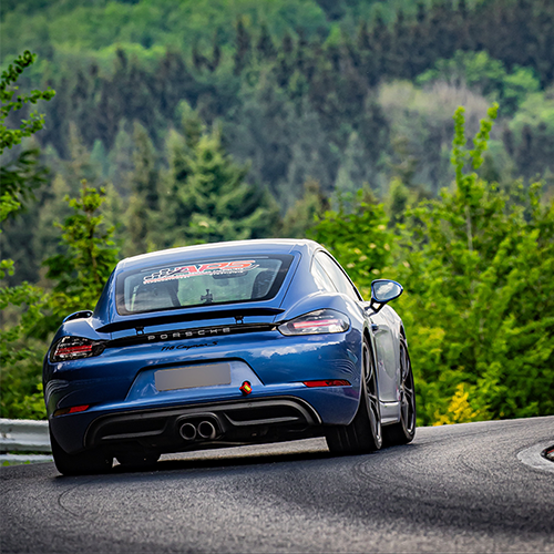 Porsche Cayman on then Nurburgring boasting Automotive Performance Specialist's branding